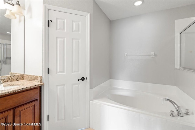 781 Dinner St NE, Palm Bay, FL 32907 - full bathroom with a garden tub, vanity, and recessed lighting