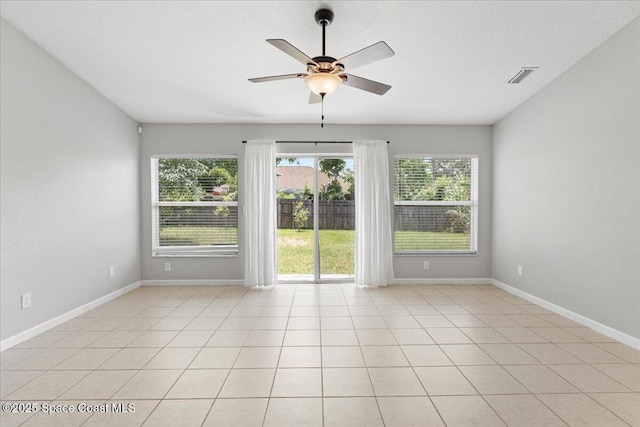 781 Dinner St NE, Palm Bay, FL 32907 - empty room with ceiling fan and light tile patterned floors