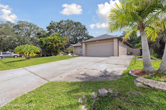 149 Hawthorne Ln NE, Palm Bay, FL 32907 - view of front facade with concrete driveway, a garage, and stucco siding