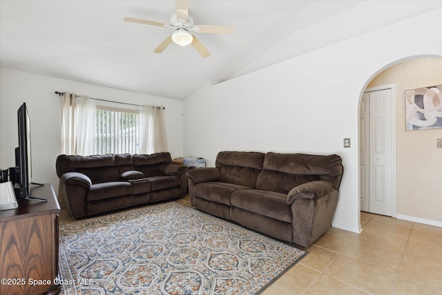149 Hawthorne Ln NE, Palm Bay, FL 32907 - living area featuring arched walkways, a ceiling fan, lofted ceiling, and light tile patterned flooring