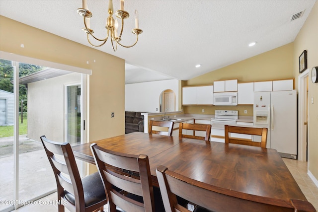 149 Hawthorne Ln NE, Palm Bay, FL 32907 - dining area featuring lofted ceiling, a chandelier, a textured ceiling, and recessed lighting