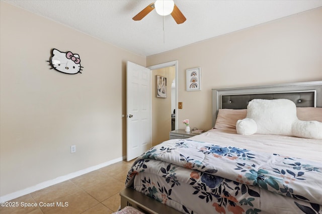 149 Hawthorne Ln NE, Palm Bay, FL 32907 - bedroom with light tile patterned flooring and a ceiling fan