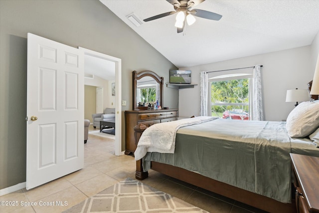 149 Hawthorne Ln NE, Palm Bay, FL 32907 - bedroom with vaulted ceiling, multiple windows, light tile patterned floors, and ceiling fan