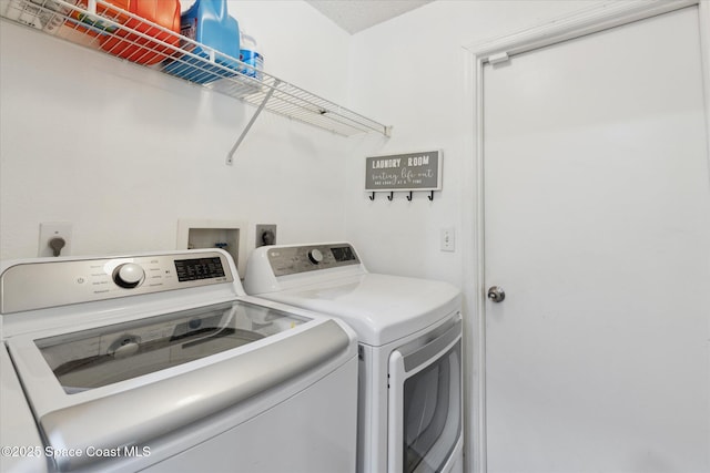 149 Hawthorne Ln NE, Palm Bay, FL 32907 - laundry room featuring separate washer and dryer