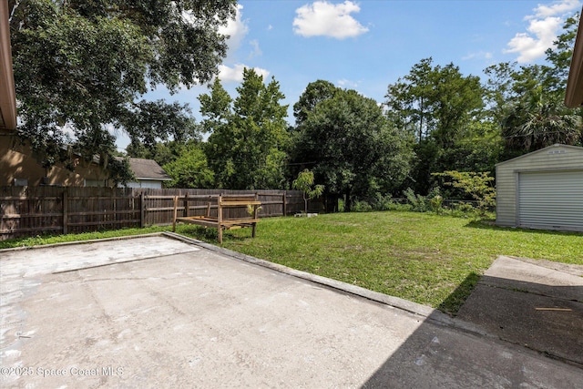 149 Hawthorne Ln NE, Palm Bay, FL 32907 - fenced backyard featuring a patio area and a storage shed