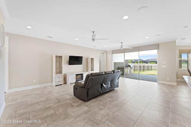 7684 Poulicny Ln, Melbourne, FL 32940 - living room with a ceiling fan, ornamental molding, healthy amount of natural light, and recessed lighting