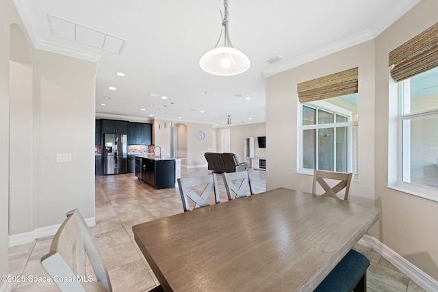 7684 Poulicny Ln, Melbourne, FL 32940 - dining area with ornamental molding, recessed lighting, and light tile patterned floors