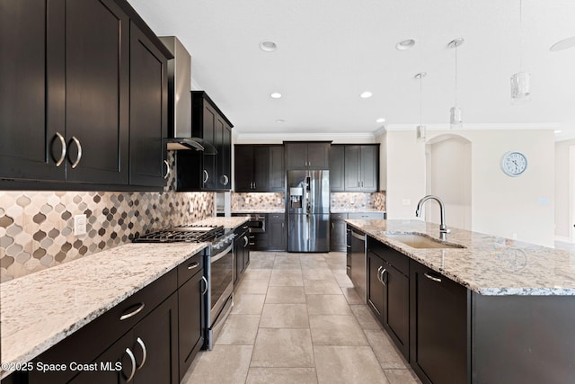 7684 Poulicny Ln, Melbourne, FL 32940 - kitchen with stainless steel appliances, crown molding, wall chimney range hood, decorative backsplash, and an island with sink