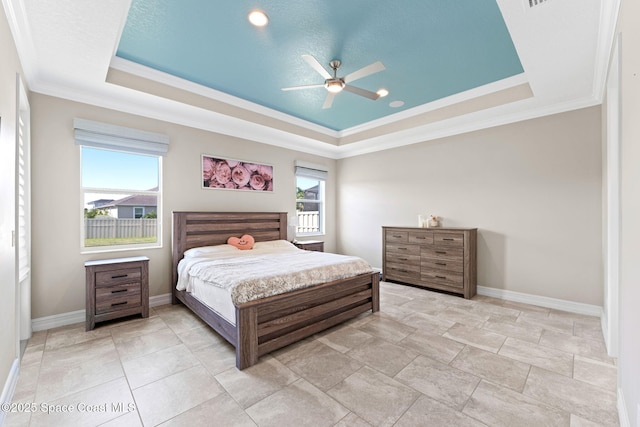 7684 Poulicny Ln, Melbourne, FL 32940 - bedroom featuring a tray ceiling, crown molding, and a ceiling fan