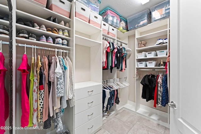 7684 Poulicny Ln, Melbourne, FL 32940 - spacious closet featuring tile patterned floors