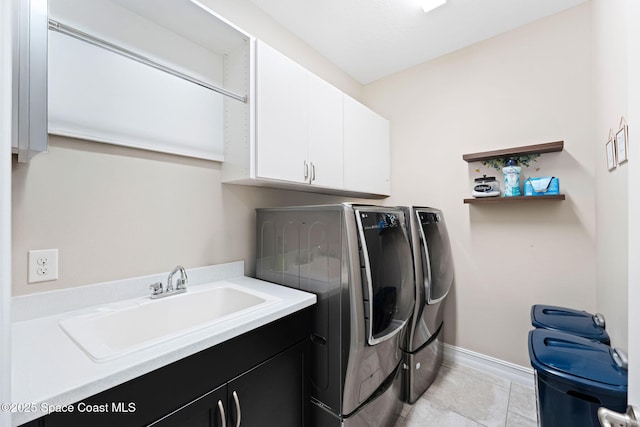 7684 Poulicny Ln, Melbourne, FL 32940 - washroom featuring washing machine and dryer, cabinet space, and light tile patterned floors