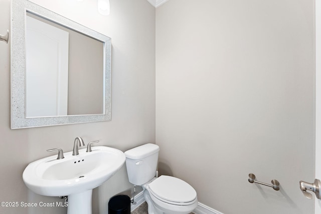7684 Poulicny Ln, Melbourne, FL 32940 - half bath with toilet and ornamental molding