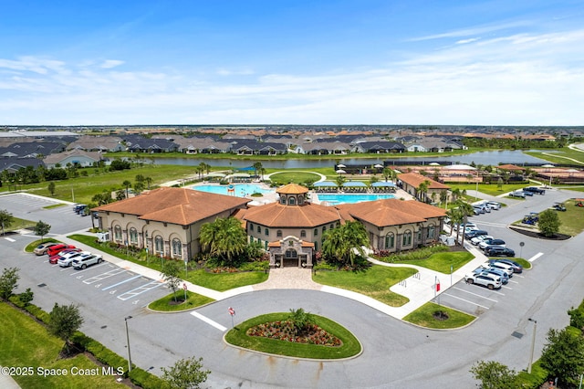 7684 Poulicny Ln, Melbourne, FL 32940 - aerial view of residential area featuring a large body of water and a pool