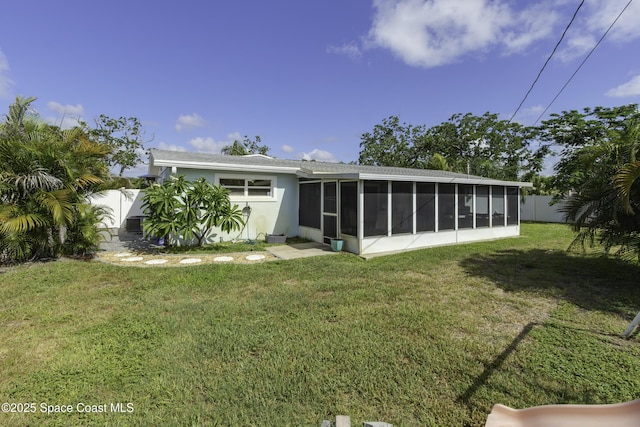 449 Amity Ave, Cocoa, FL 32927 - back of house featuring a sunroom and stucco siding