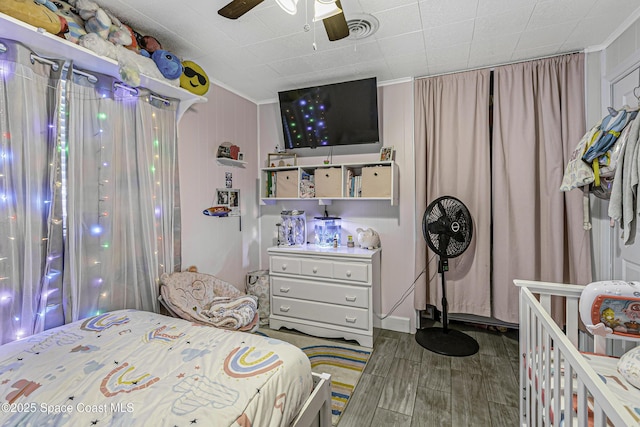 449 Amity Ave, Cocoa, FL 32927 - bedroom with ornamental molding, wood finished floors, and ceiling fan