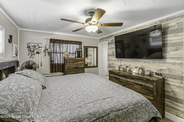 449 Amity Ave, Cocoa, FL 32927 - bedroom with wood walls, crown molding, ceiling fan, and a textured ceiling