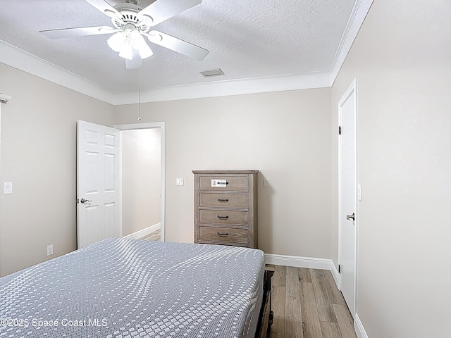 3090 Rio Pino S, Indialantic, FL 32903 - bedroom featuring wood finished floors, a textured ceiling, ceiling fan, and ornamental molding