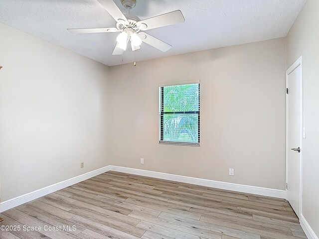 3090 Rio Pino S, Indialantic, FL 32903 - empty room with wood finished floors and a ceiling fan