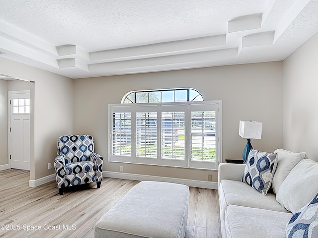3090 Rio Pino S, Indialantic, FL 32903 - living area featuring light wood-style flooring and a textured ceiling