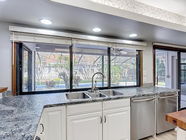 3090 Rio Pino S, Indialantic, FL 32903 - kitchen featuring dishwasher, white cabinetry, recessed lighting, and light wood-style flooring