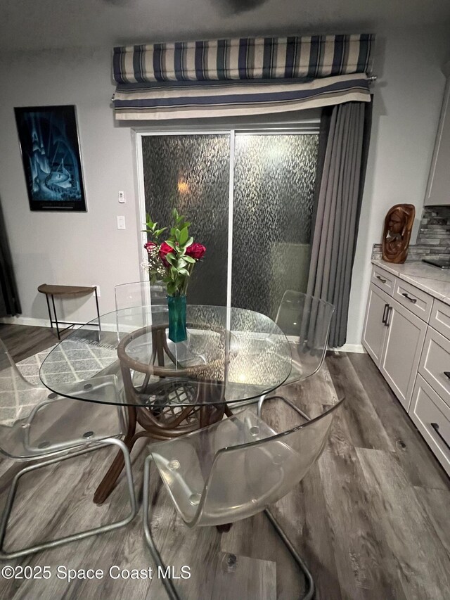 1015 Swiss Pointe Ln, Rockledge, FL 32955 - dining room with dark wood-style flooring