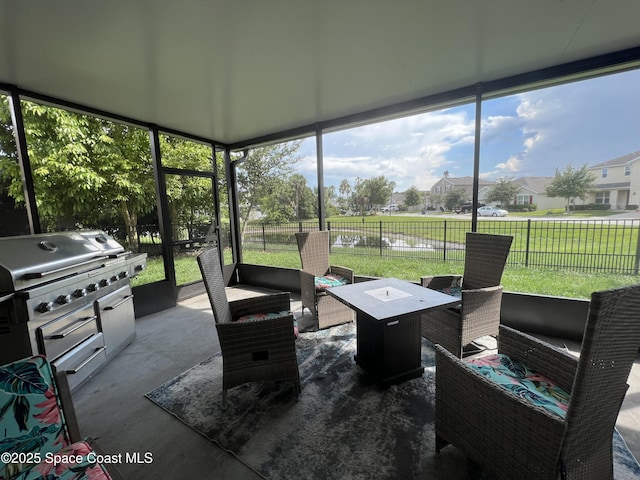 1015 Swiss Pointe Ln, Rockledge, FL 32955 - sunroom featuring an outdoor hangout area, plenty of natural light, and a residential view