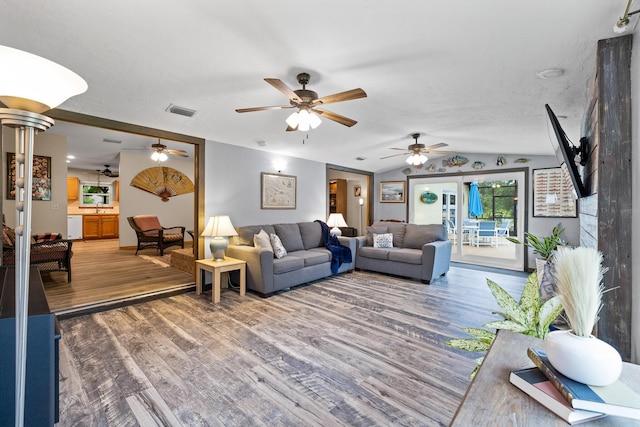 4685 Lee St, Cocoa, FL 32926 - living room featuring wood finished floors, vaulted ceiling, ceiling fan, and ornate columns