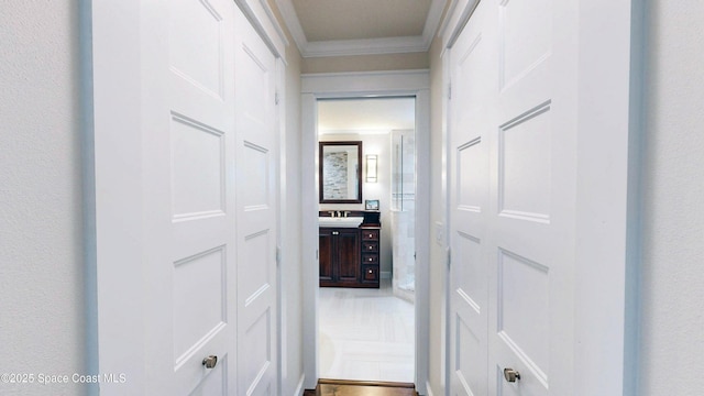 211 Jamaica Dr, Cocoa Beach, FL 32931 - hall featuring crown molding and a sink