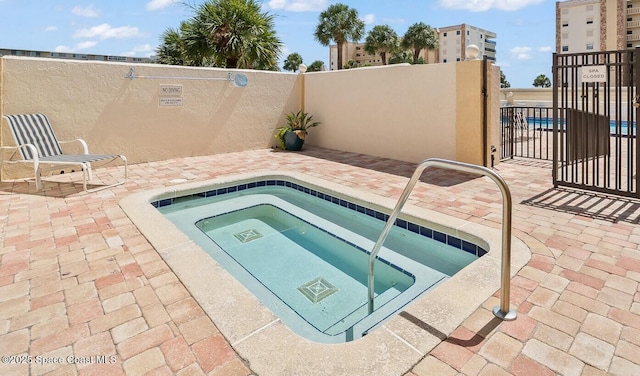 1890 N Atlantic Ave Unit A501, Cocoa Beach, FL 32931 - view of swimming pool featuring a hot tub