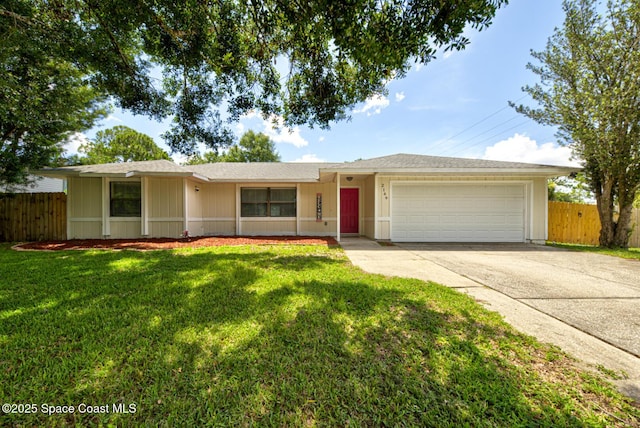 2169 Wagonwheel Ave SE, Palm Bay, FL 32909 - ranch-style house with driveway and an attached garage