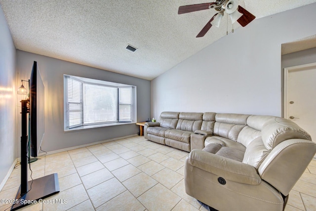 2169 Wagonwheel Ave SE, Palm Bay, FL 32909 - living area with a ceiling fan, a textured ceiling, vaulted ceiling, and light tile patterned floors