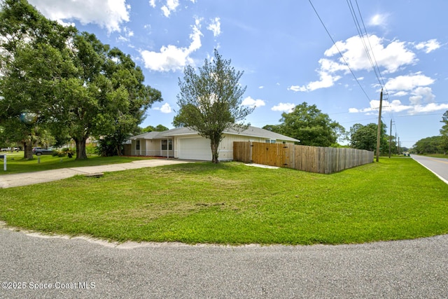 2169 Wagonwheel Ave SE, Palm Bay, FL 32909 - view of front of property featuring concrete driveway and a garage