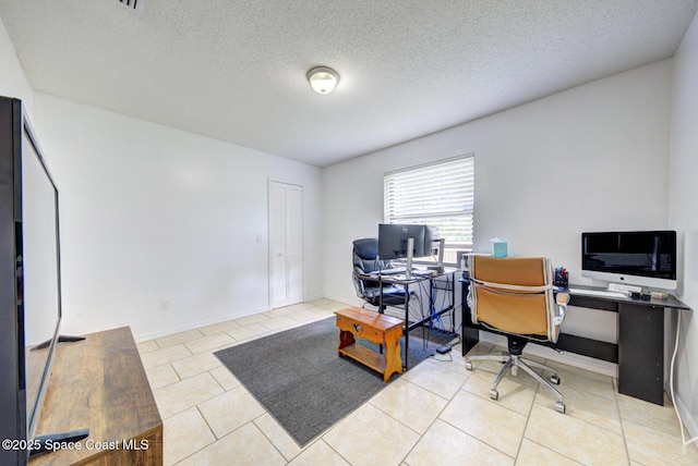 2169 Wagonwheel Ave SE, Palm Bay, FL 32909 - tiled office space featuring a textured ceiling and baseboards