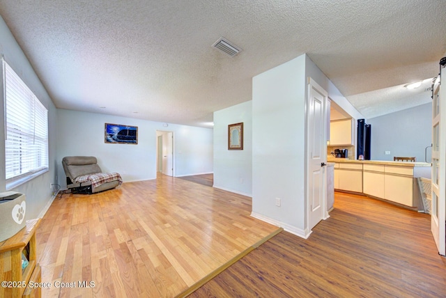 2169 Wagonwheel Ave SE, Palm Bay, FL 32909 - living area featuring wood finished floors and a textured ceiling