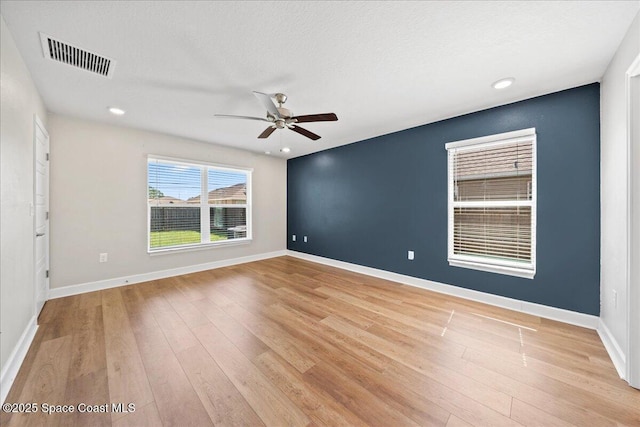 215 Olin Rd SW, Palm Bay, FL 32908 - spare room featuring light wood-style floors, ceiling fan, and recessed lighting