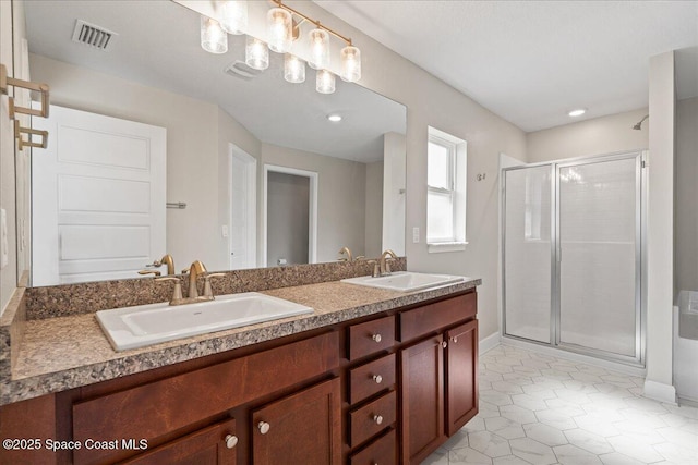 215 Olin Rd SW, Palm Bay, FL 32908 - bathroom with a stall shower, double vanity, and tile patterned flooring