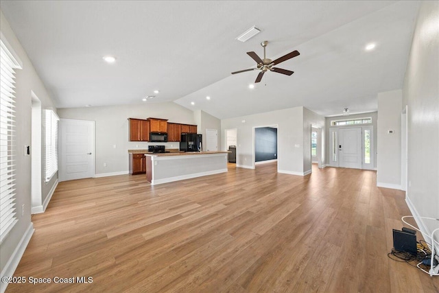 215 Olin Rd SW, Palm Bay, FL 32908 - unfurnished living room with lofted ceiling, light wood-style flooring, ceiling fan, and recessed lighting