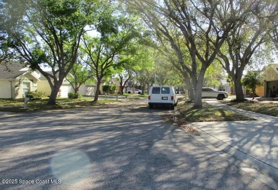 7603 Wiltshire Park Pl, Apollo Beach, FL 33572 - view of asphalt road featuring a residential view