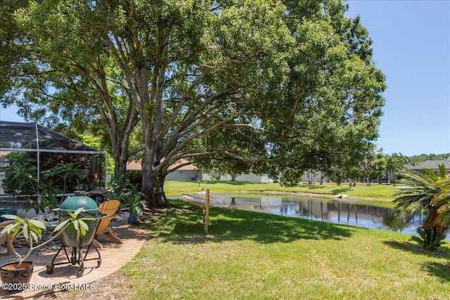 970 Pelican Ln, Rockledge, FL 32955 - view of grassy yard with a water view and glass enclosure