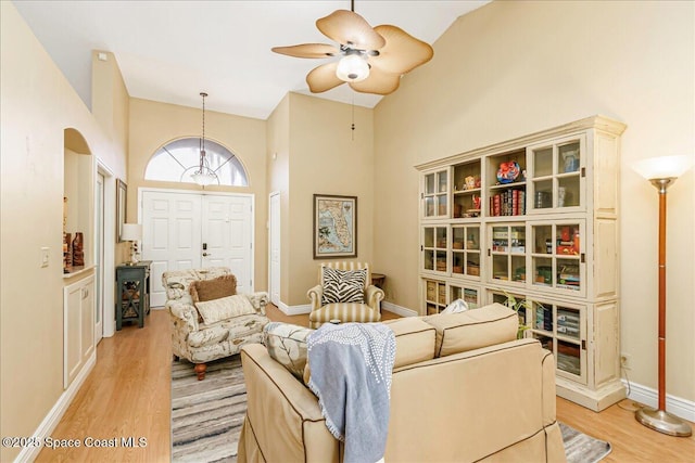 970 Pelican Ln, Rockledge, FL 32955 - living room featuring light wood-type flooring, ceiling fan, and a high ceiling
