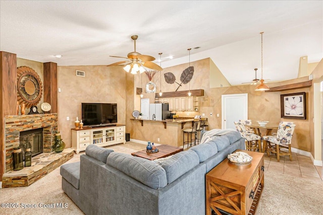 970 Pelican Ln, Rockledge, FL 32955 - living room with a ceiling fan, a fireplace, light tile patterned flooring, and high vaulted ceiling