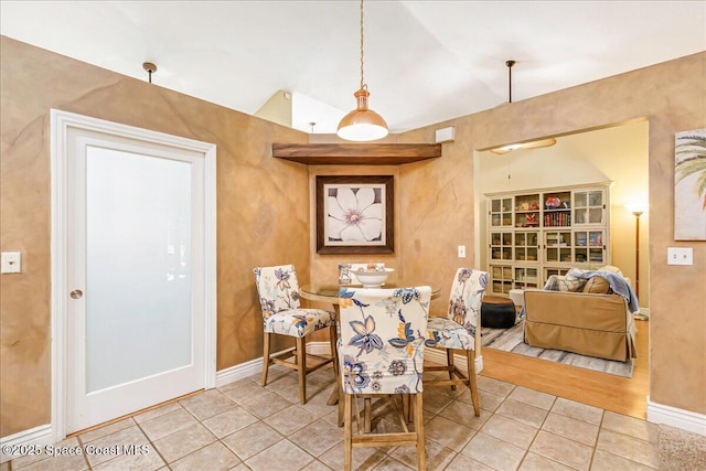 970 Pelican Ln, Rockledge, FL 32955 - dining room featuring light tile patterned floors and lofted ceiling