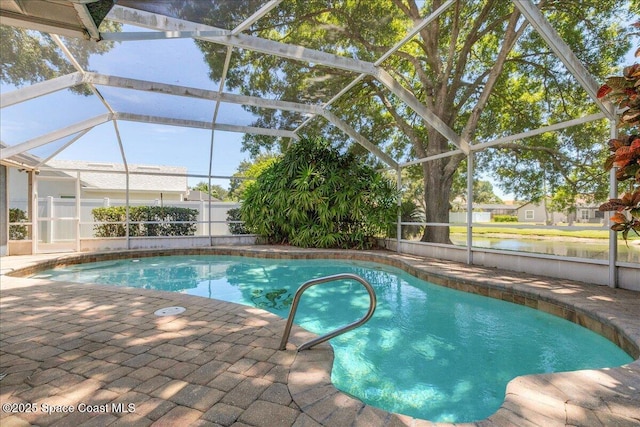 970 Pelican Ln, Rockledge, FL 32955 - view of swimming pool featuring a patio area, a lanai, and a water view