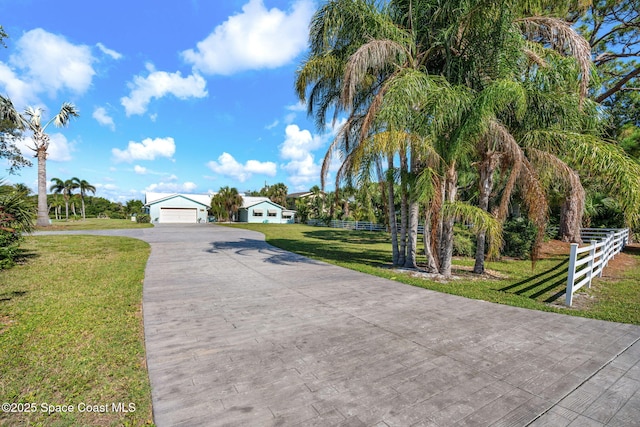 2945 Newfound Harbor Dr, Merritt Island, FL 32952 - view of front of house with a garage and driveway