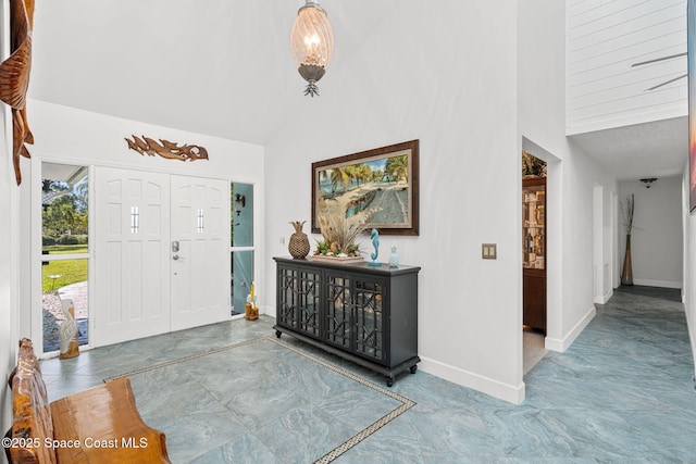 2945 Newfound Harbor Dr, Merritt Island, FL 32952 - foyer entrance with high vaulted ceiling and marble finish flooring