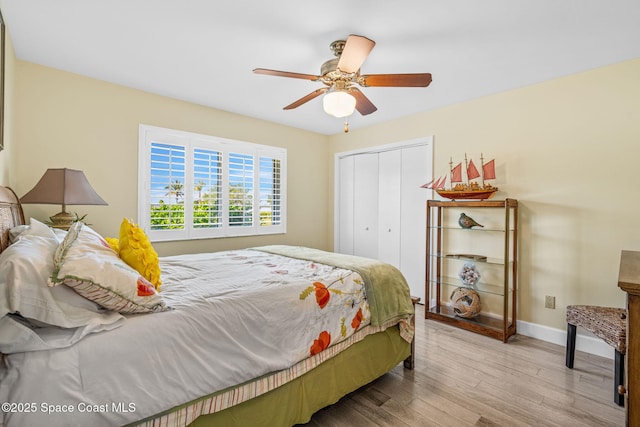 2945 Newfound Harbor Dr, Merritt Island, FL 32952 - bedroom featuring wood finished floors, a closet, and ceiling fan
