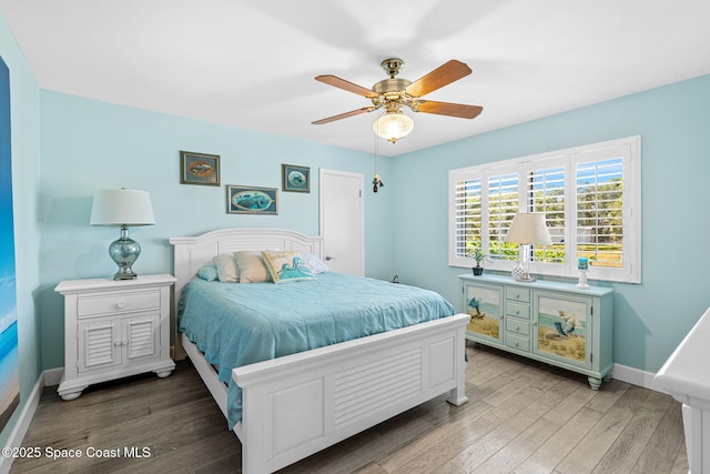 2945 Newfound Harbor Dr, Merritt Island, FL 32952 - bedroom featuring wood finished floors and a ceiling fan