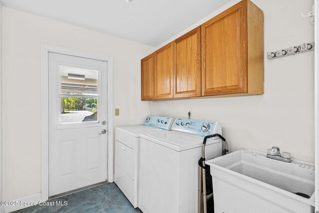 2945 Newfound Harbor Dr, Merritt Island, FL 32952 - laundry area with cabinet space and washer and clothes dryer