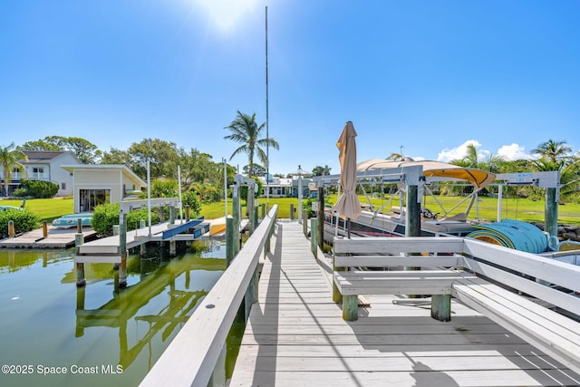 2945 Newfound Harbor Dr, Merritt Island, FL 32952 - dock with boat lift and a water view