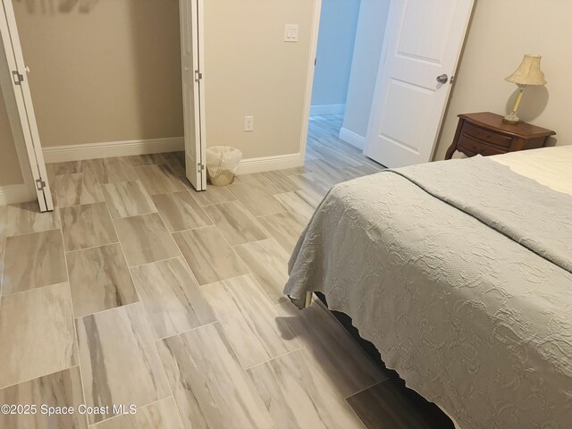 1305 Rabbit Street Se Port Malabar Unit 22, Palm Bay, FL 32909 - bedroom with baseboards